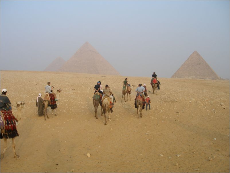 Crew on camels on way to the Pyramids